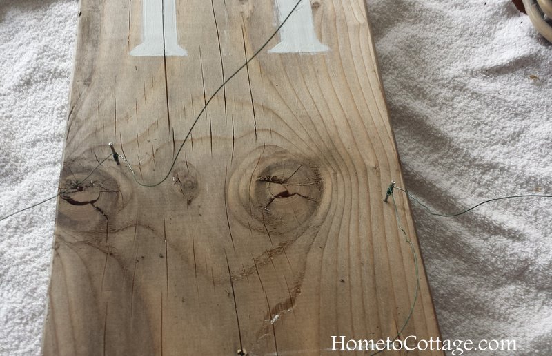 HometoCottage.com nails with wires to securely hold the wreath on